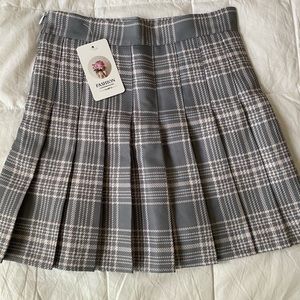 A gray and light pink tennis skirt. Never worn!